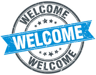 welcome blue round grunge vintage ribbon stamp