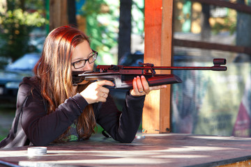 Smart girl shooting from air gun