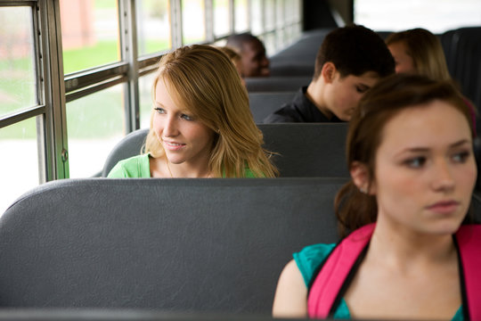 School Bus: Cheerful Girl Riding School Bus