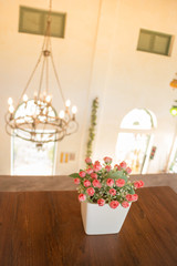 Wooden table decorated with flower bouquet