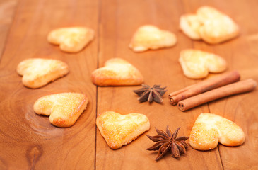 Fototapeta na wymiar Cookies in the shape of a heart on wooden background