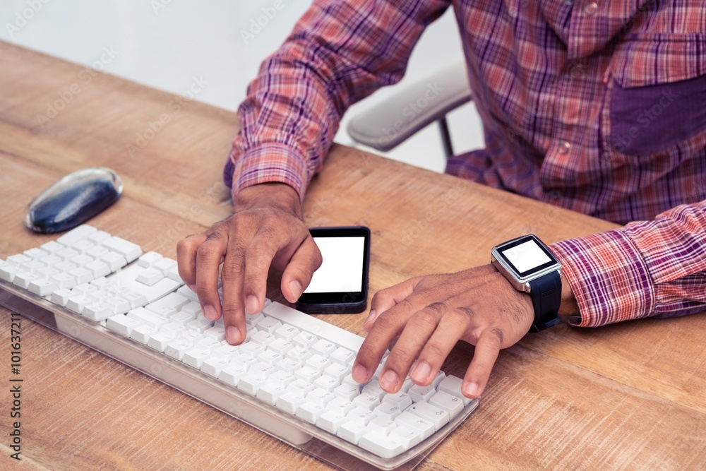 Poster Businessman typing on computer keyboard on desk
