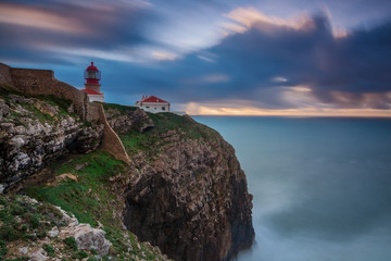 Sunset near the lighthouse in Sagres. Portugal, Algarve.
