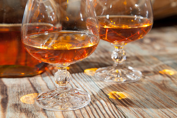 Glasses of cognac and a bottle