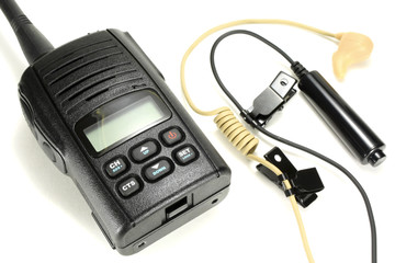 Portable walkie-talkie with headset isolated on a white background