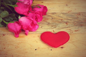 Fototapeta premium Rose with red hearts for Valentine's Day.