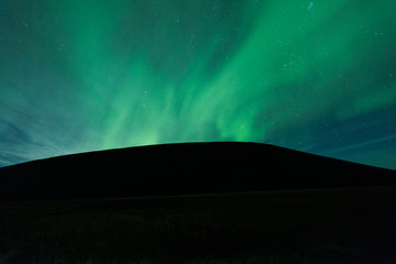 Aurora borealis above a mountain