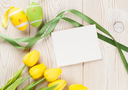Easter eggs, tulips and blank card