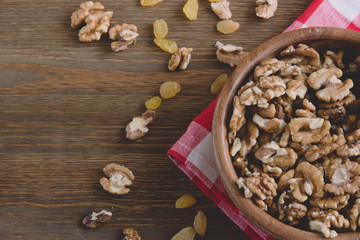 Dried fruits and nuts in a wooden bowl