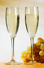 Champagne glasses and grapes