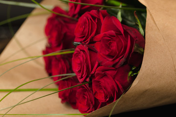 Bouquet of red roses on black background