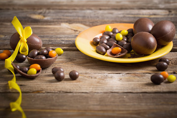 Chocolate Easter Eggs Over Wooden Background
