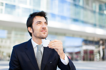 Portrait of a businessman drinking a coffee 