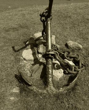 Sepia image of an old anchor