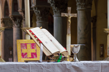 Altar with chalice and Missal during a traditional old latin rite Catholic mass