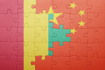 puzzle with the national flag of china and guinea