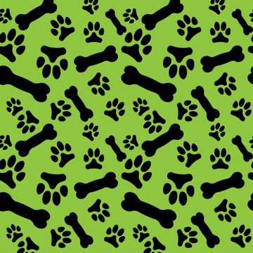 Seamless Pattern With Black Dog Paw Prints And Bones On A Green Background