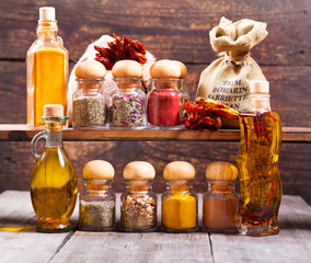 various dried spices on wooden background