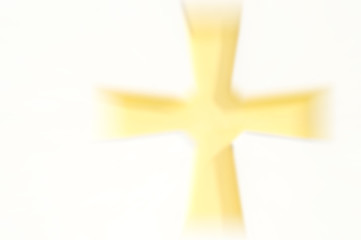 Abstract artistic blur background with yellow cross on white with copy space for text
