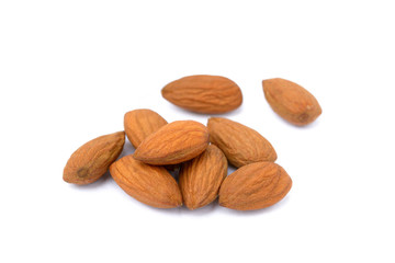 Group unpeeled almonds isolated on white background