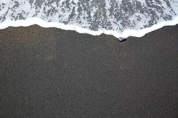 Fotobehang Black sand beach with wave foam Fuerteventura © lunamarina