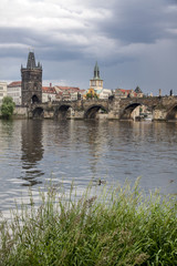Fototapeta na wymiar Prague. View from Vltava to the Charles Bridge and the Old Town