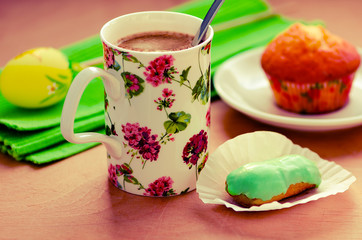 Cofee and green matcha tea eclair, cupcake, Easter egg