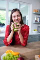 Smiling brunette holding cup