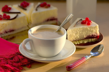 Fototapeta na wymiar Coffee and red currant cheesecake