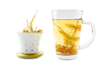 Lime tea cup with dried blossom  isolated on white