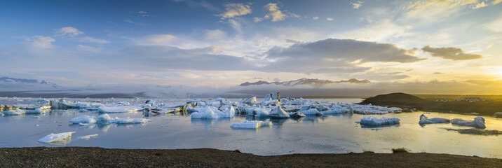 floated ice in icebergs lagoon in sunrise time in Iceland