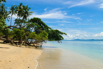 Beach on Siladen island in Bunaken National Marine Park, Sulawesi, Indonesia