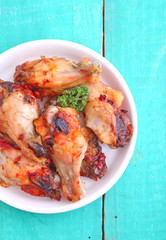 Chicken wings fried in tomato sauce