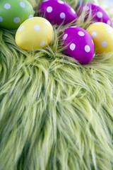 Easter eggs on green pillow