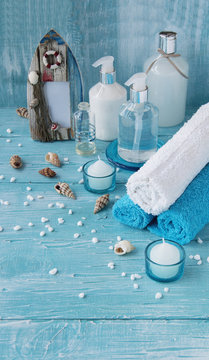 White flowers lying on and candle Spa set