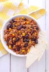 minced meat with corn, sweet peppers and beans in a dish