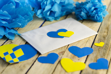 letter with yellow and blue hearts