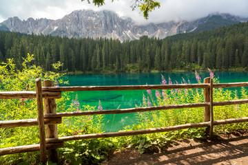 Lake Carezza during summer season, Dolomites mountains, Italy