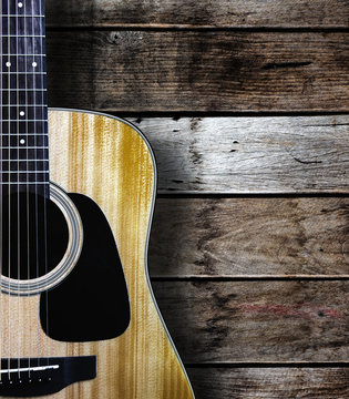Guitar on wood background.