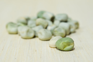 Peas on wooden board