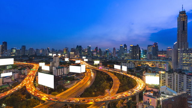 Time Lapse Day To Night Cityscape And Many White Billboard Of Bangkok, Thailand