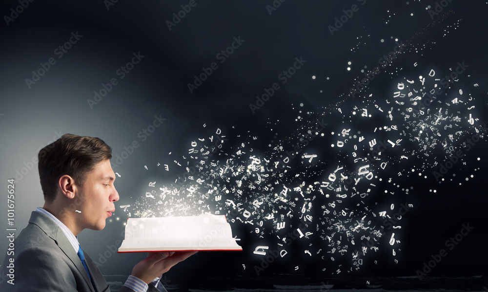 Wall mural businessman with opened book