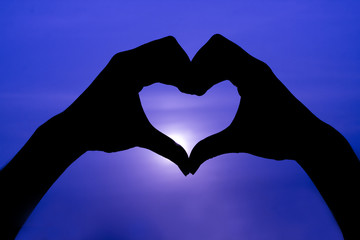 Fototapeta premium Female make hands heart on valentine day. 