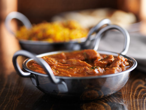 tasty indian chicken curry in balti dish