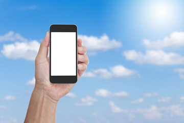 Hand holding blank screen mobile phone with clouds blue sky back