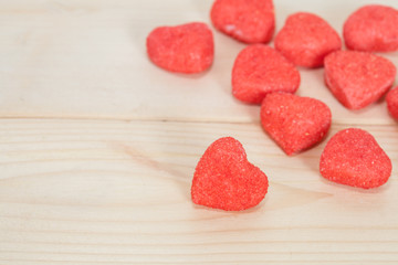 Fototapeta na wymiar heart candies coated with sugar sitting on