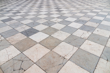 Old and partly cracked tiled floor