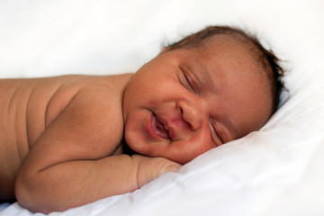 Fototapeta na wymiar Black newborn baby sleeping soundly