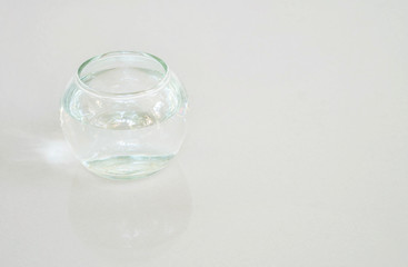 Closeup glass cup with water on gray marble stone floor background