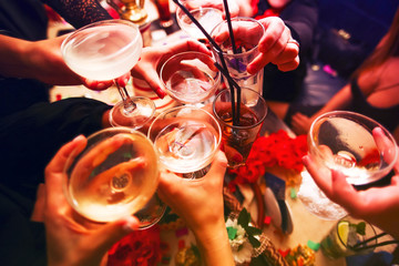 Clinking glasses and toasting